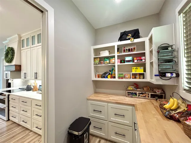 a view of kitchen center with furniture and window