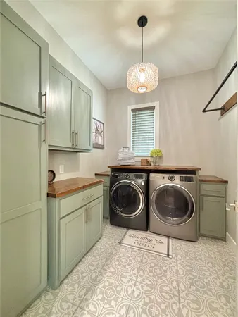 a view of a kitchen with a sink and cabinets