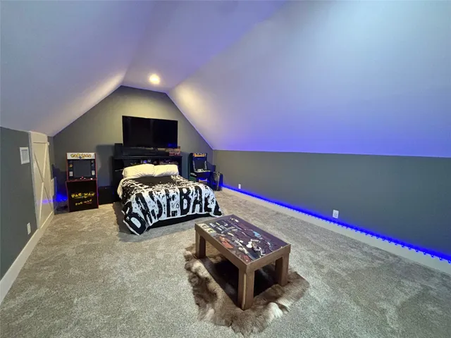 a bedroom with bed and a night stand