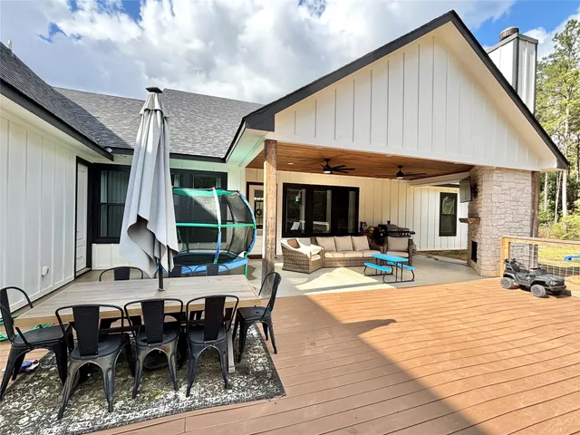 a view of a dinning table and chairs in the patio