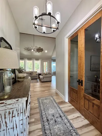 a kitchen with stainless steel appliances granite countertop a sink a counter space and cabinets