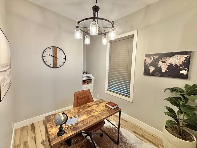 a view of a workspace with furniture