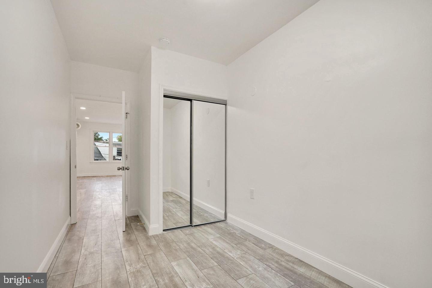 5413 Georgia Avenue Northwest Washington, DC 20011 - Photo 15 of 22 a view of a hallway with wooden floor