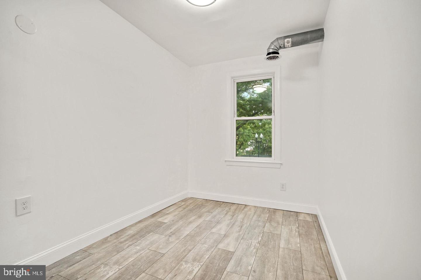 5413 Georgia Avenue Northwest Washington, DC 20011 - Photo 16 of 22 an empty room with a window
