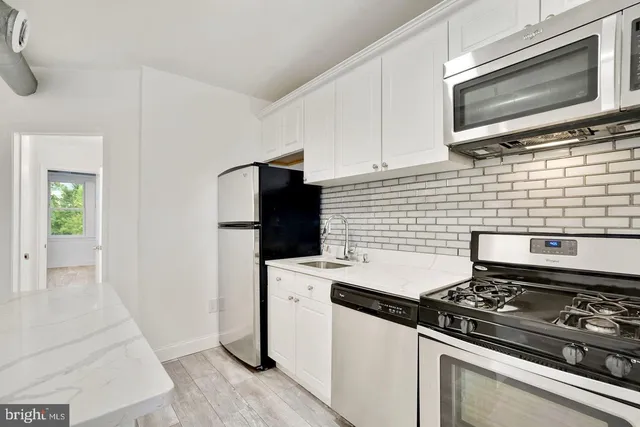 a kitchen with a stove and a microwave