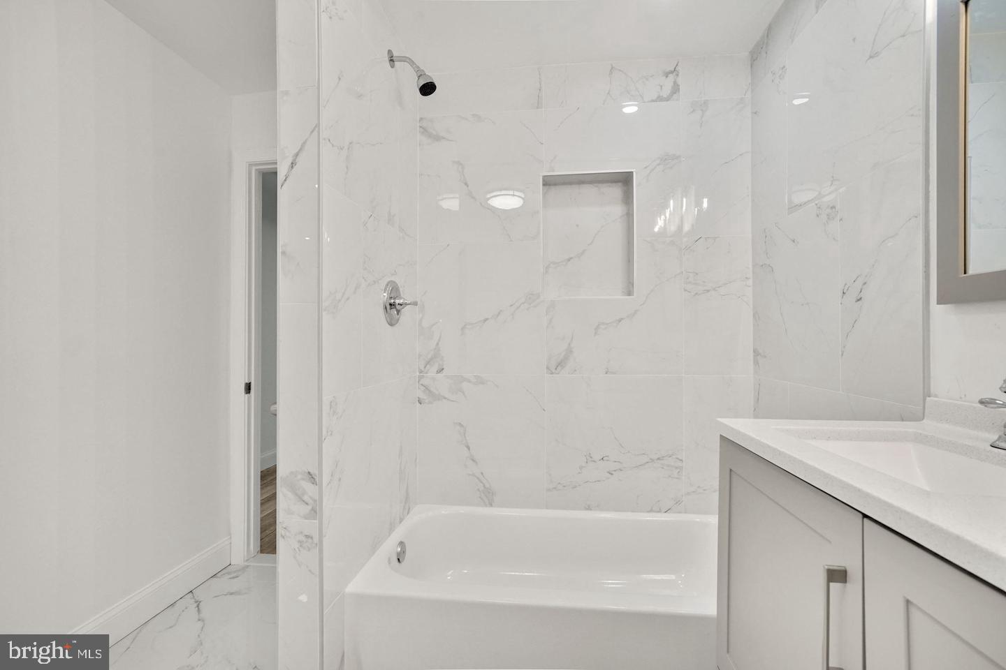 5413 Georgia Avenue Northwest Washington, DC 20011 - Photo 8 of 22 a bathroom with a bathtub and a sink