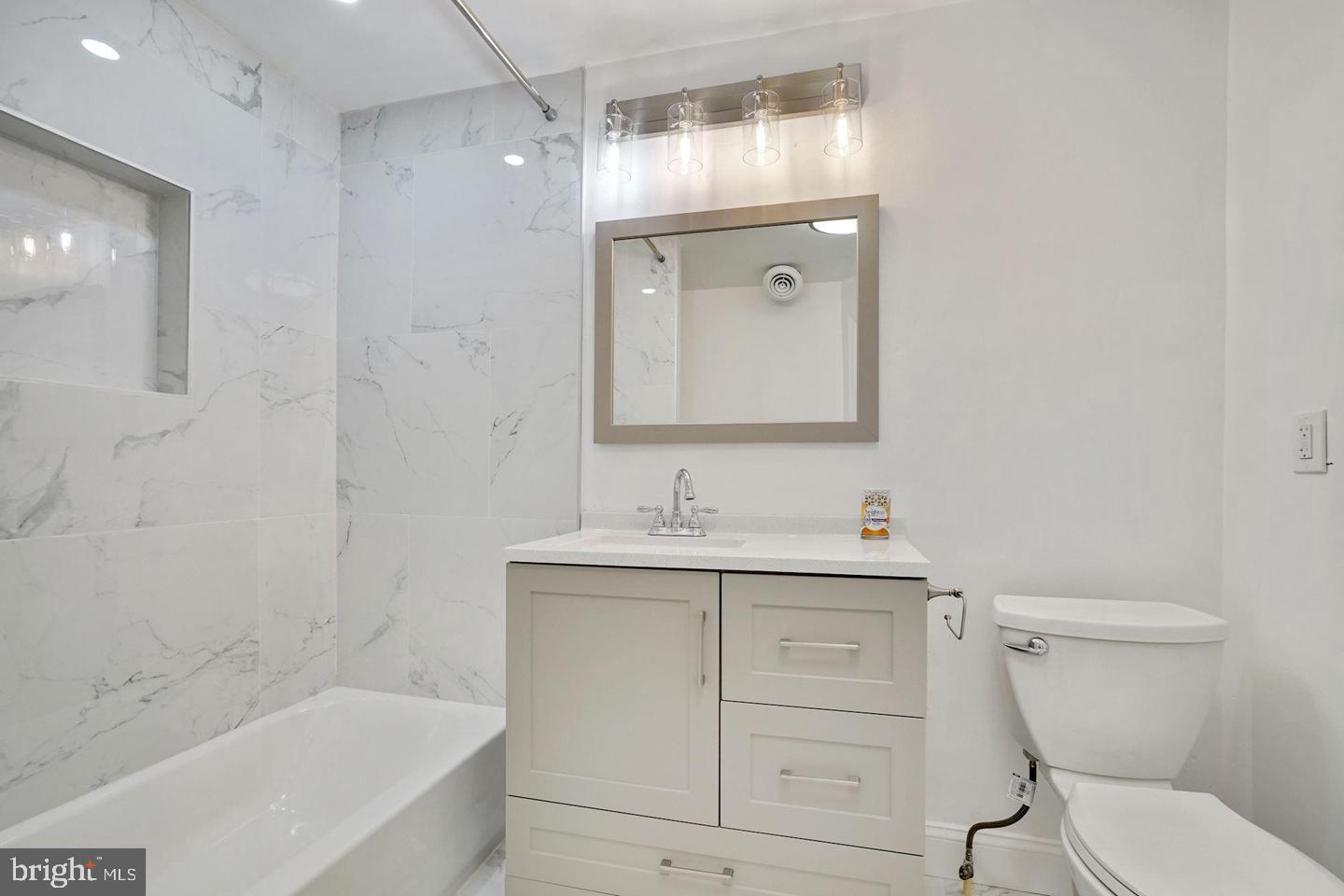 5413 Georgia Avenue Northwest Washington, DC 20011 - Photo 9 of 22 a bathroom with a sink a toilet and shower
