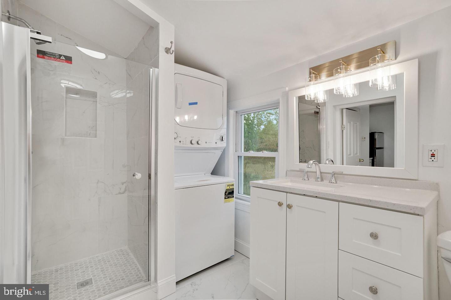 5413 Georgia Avenue Northwest Washington, DC 20011 - Photo 10 of 22 a bathroom with a granite countertop sink mirror and