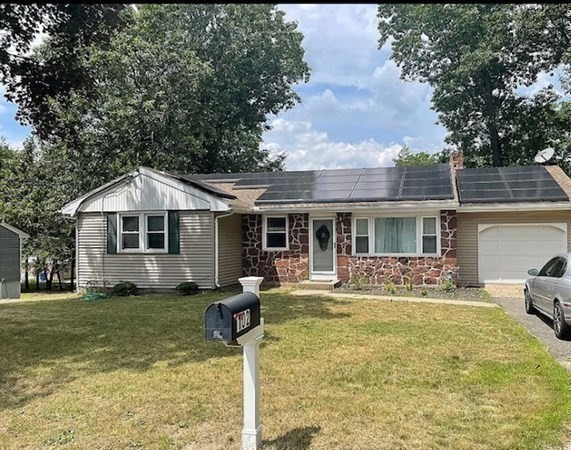102 Harrow Road Springfield, MA 01118 - Photo 11 of 35 a front view of house with yard patio and fire pit