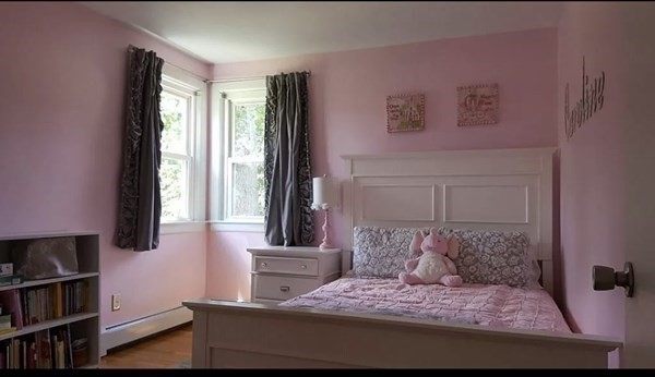 102 Harrow Road Springfield, MA 01118 - Photo 20 of 35 a bedroom with a large bed and a book shelf