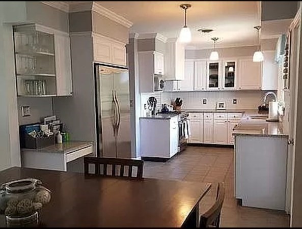 102 Harrow Road Springfield, MA 01118 - Photo 2 of 35 a kitchen with stainless steel appliances granite countertop a refrigerator a stove and a sink