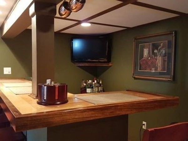 102 Harrow Road Springfield, MA 01118 - Photo 29 of 35 a room with a chandelier furniture and a flat screen tv