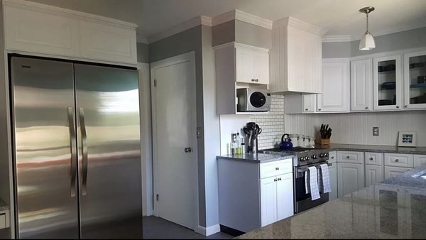 102 Harrow Road Springfield, MA 01118 - Photo 3 of 35 a kitchen with a refrigerator and a sink
