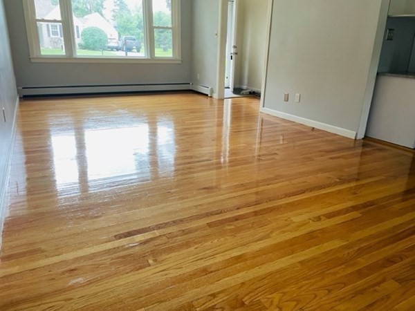 102 Harrow Road Springfield, MA 01118 - Photo 8 of 35 a view of empty room with window and wooden floor