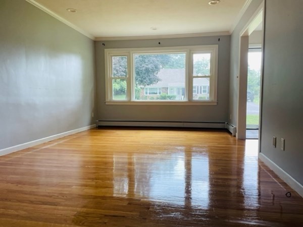 102 Harrow Road Springfield, MA 01118 - Photo 9 of 35 a view of empty room with wooden floor and fan