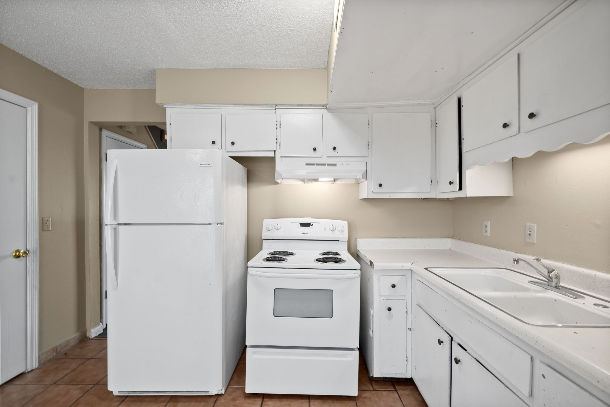 1044 Pembroke Oak Grove Road Oak Grove, KY 42262 - Photo 12 of 40 a white refrigerator freezer sitting inside of a kitchen with stainless steel appliances granite countertop white refrigerator stove and white cabinets