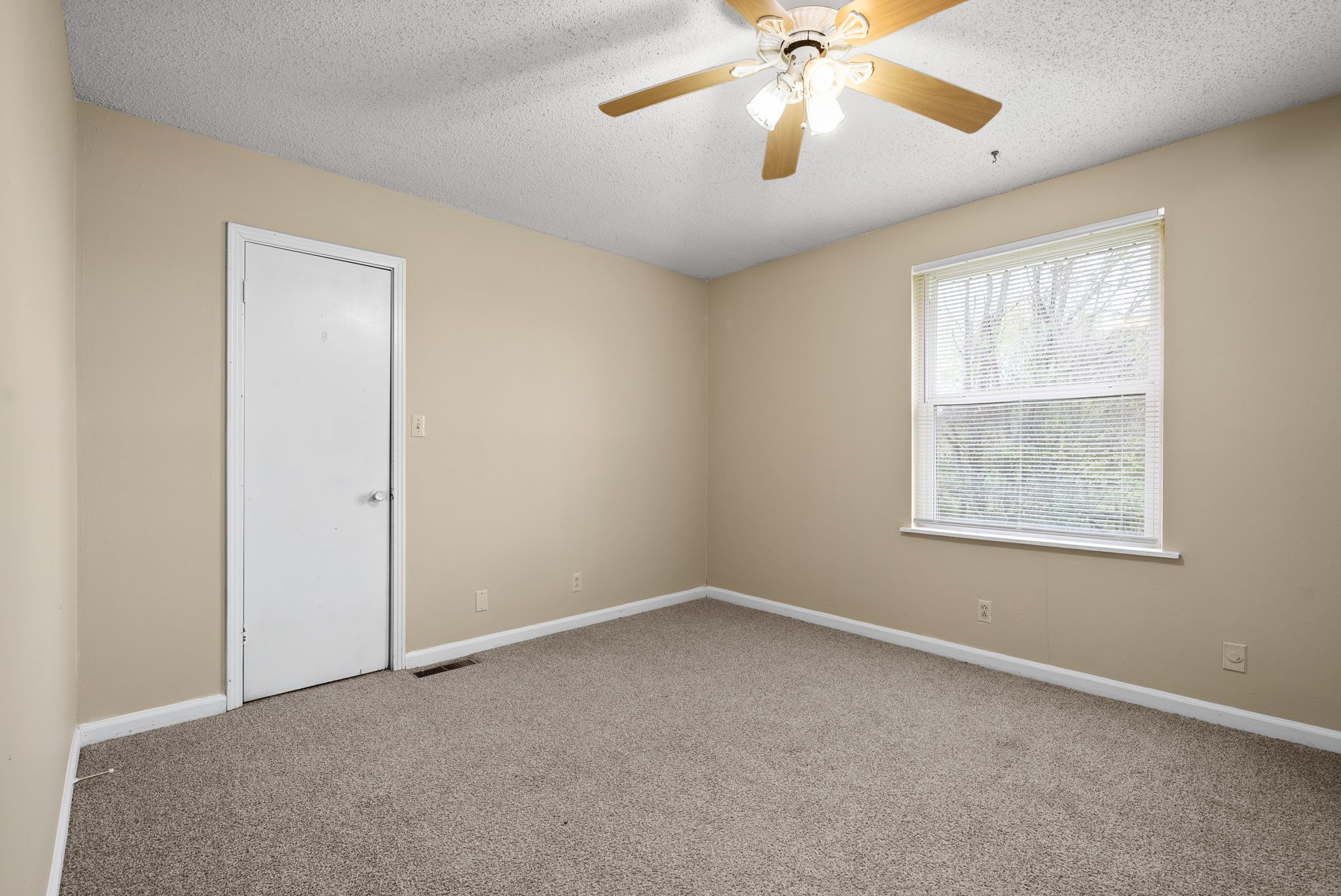 1044 Pembroke Oak Grove Road Oak Grove, KY 42262 - Photo 17 of 40 an empty room with a window and a fan