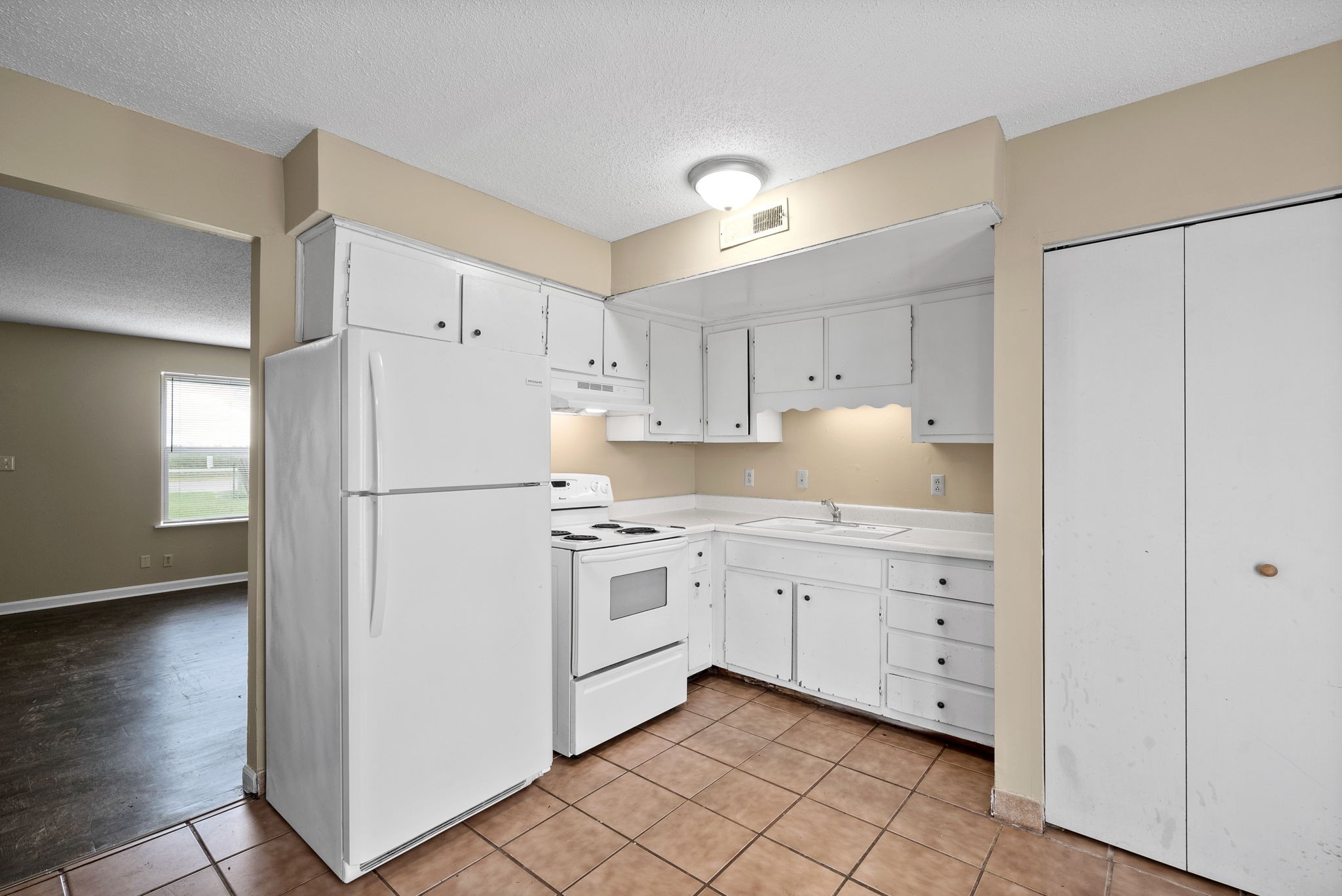 1044 Pembroke Oak Grove Road Oak Grove, KY 42262 - Photo 10 of 40 a kitchen with white cabinets and white appliances