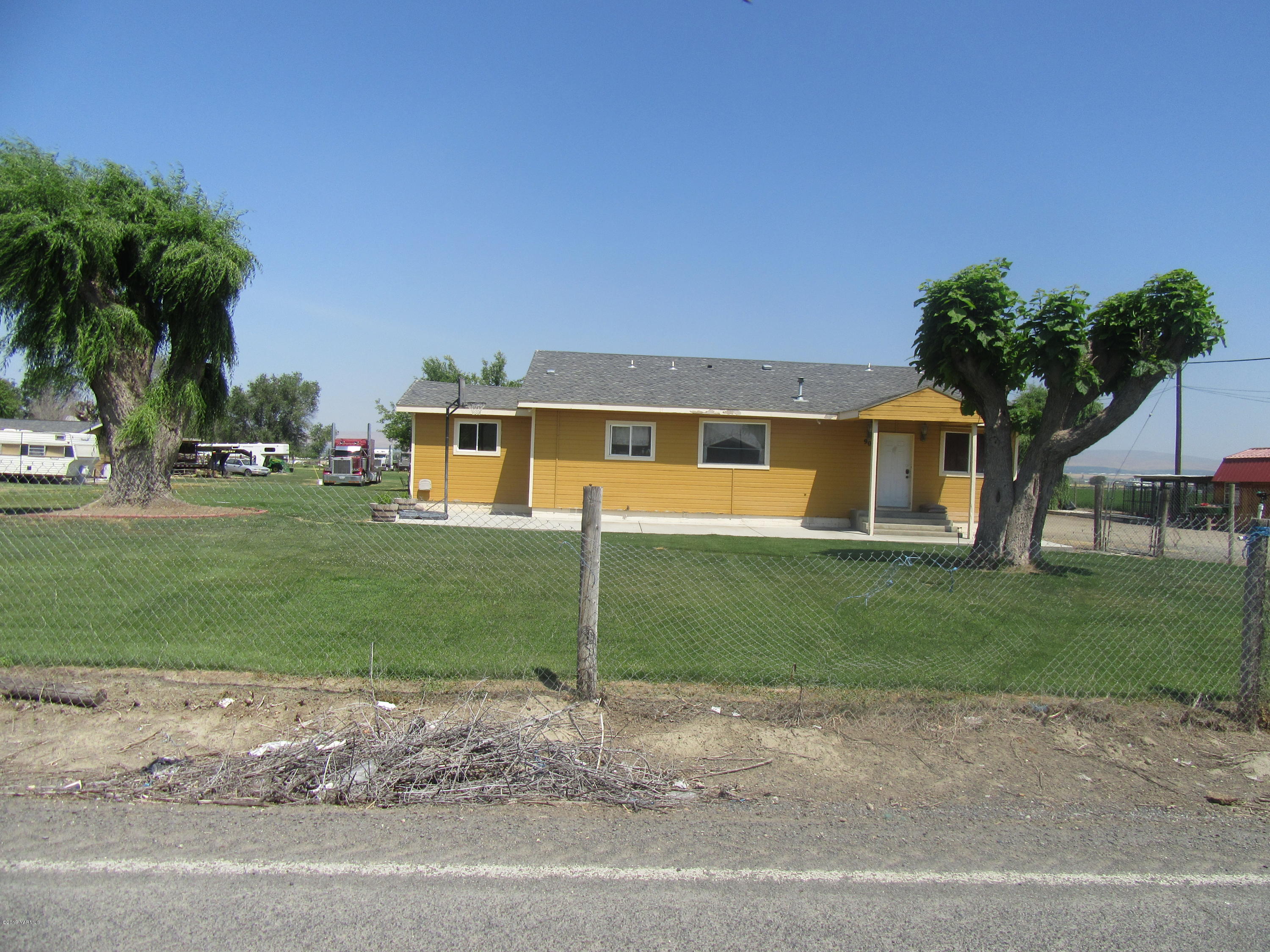 901-903 Outlook Road Outlook, WA 98938 - Photo 2 of 6 a view of a house with a yard and a street