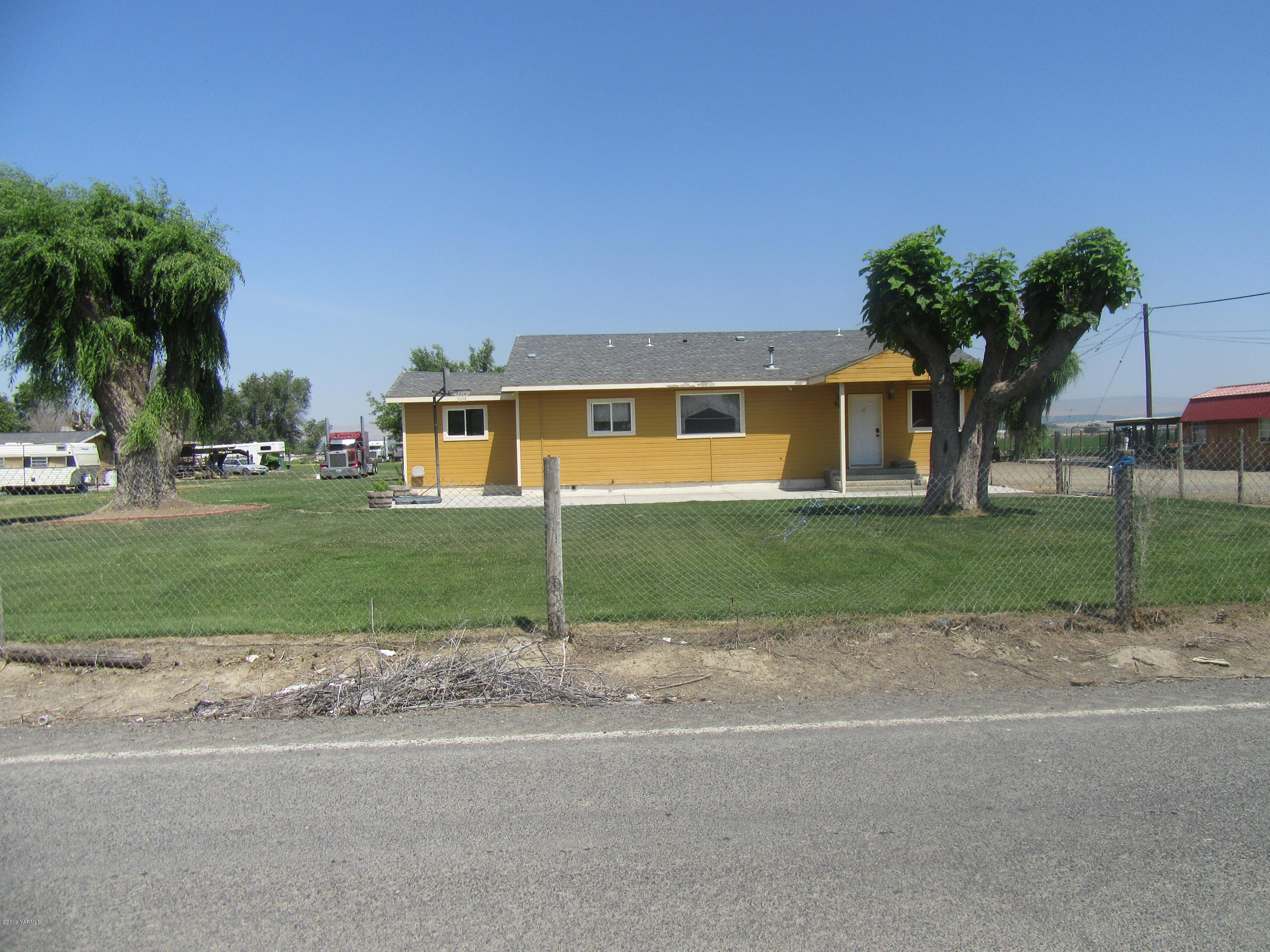 901-903 Outlook Road Outlook, WA 98938 - Photo 3 of 6 a front view of a house with a yard and garage