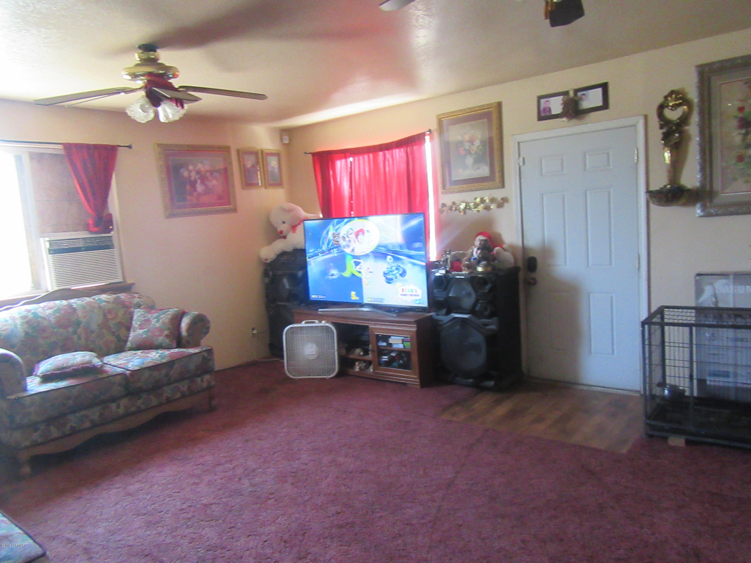 901-903 Outlook Road Outlook, WA 98938 - Photo 4 of 6 a living room with furniture and a flat screen tv