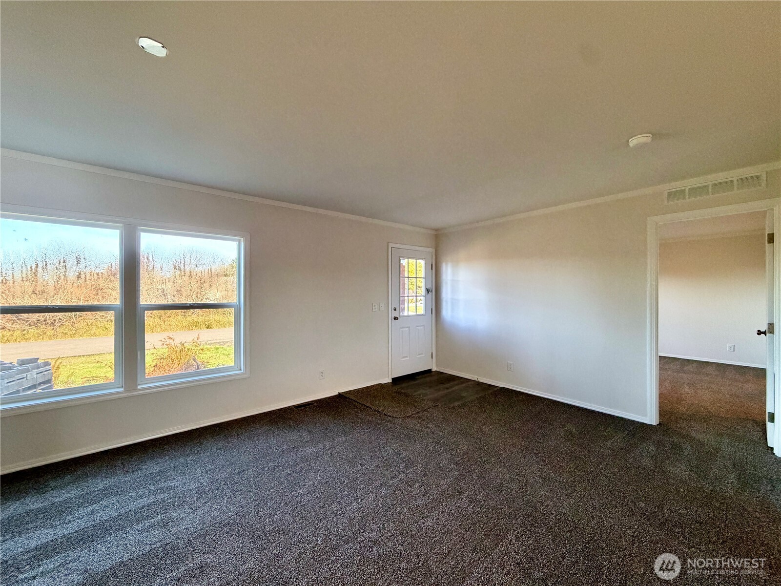 299 Octopus Avenue Northeast Ocean Shores, WA 98569 - Photo 13 of 40 an empty room with a window