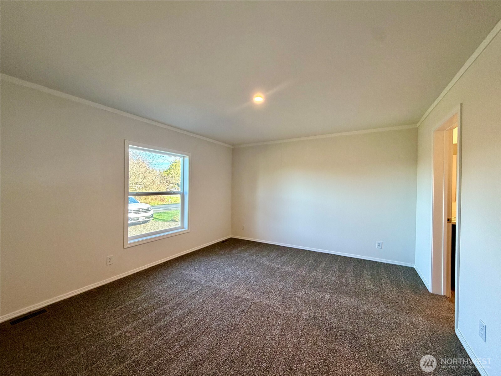 299 Octopus Avenue Northeast Ocean Shores, WA 98569 - Photo 14 of 40 an empty room with a window
