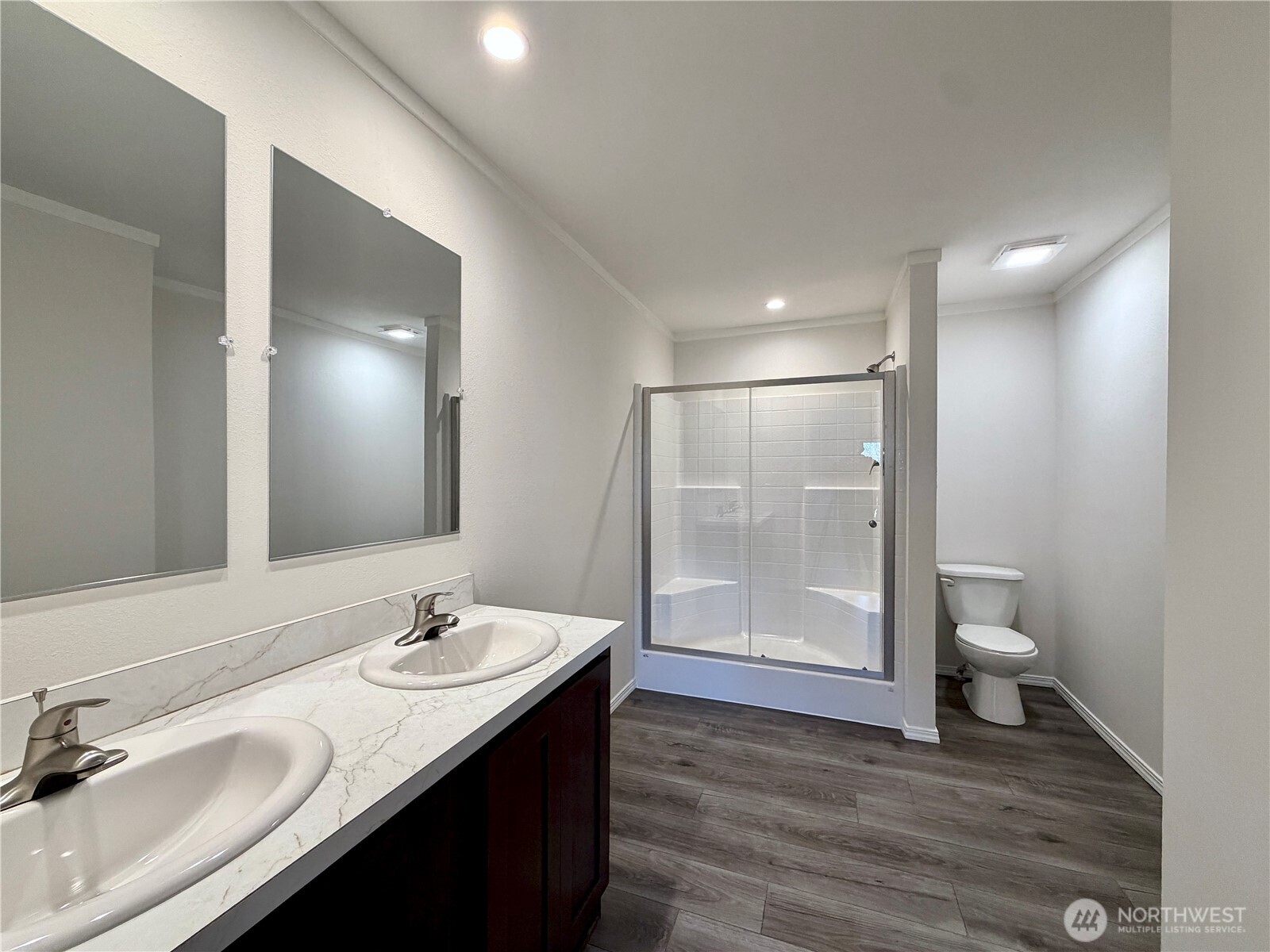 299 Octopus Avenue Northeast Ocean Shores, WA 98569 - Photo 17 of 40 a bathroom with a sink a toilet and shower