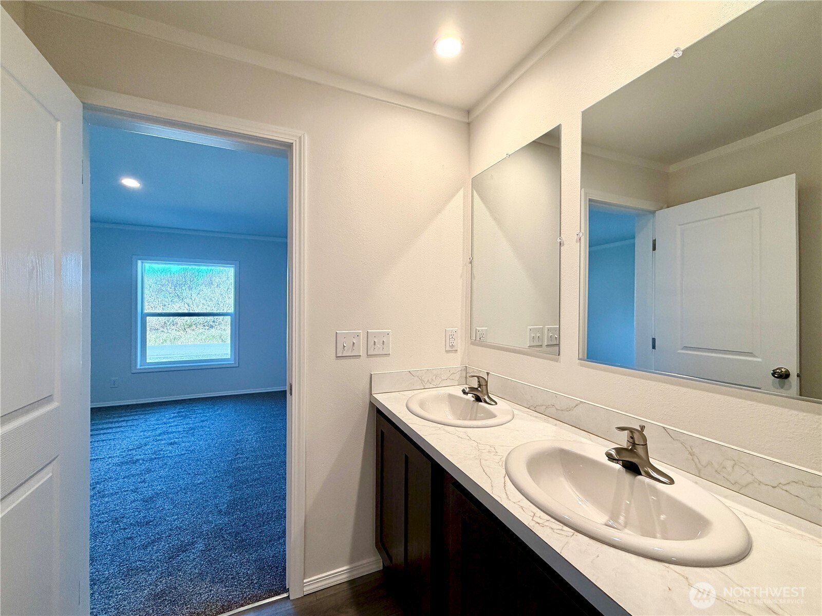299 Octopus Avenue Northeast Ocean Shores, WA 98569 - Photo 19 of 40 a bathroom with a sink and a mirror