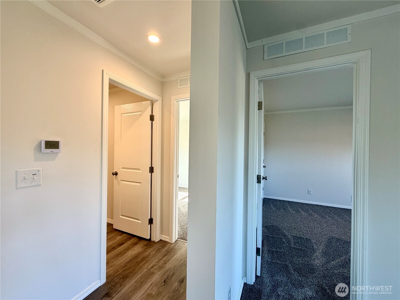 299 Octopus Avenue Northeast Ocean Shores, WA 98569 - Photo 20 of 40 a view of a hallway with wooden floor