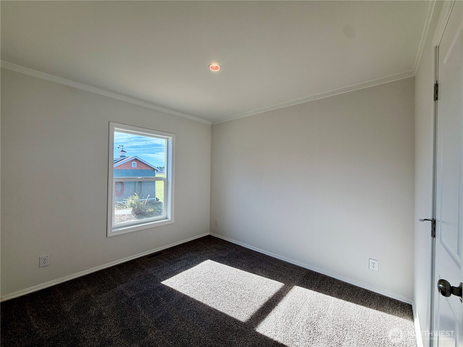 299 Octopus Avenue Northeast Ocean Shores, WA 98569 - Photo 26 of 40 an empty room with windows