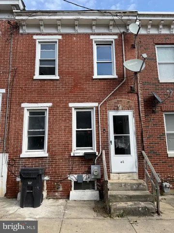 a front view of a house with glass windows