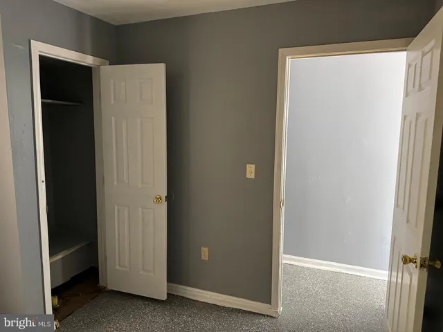 a kitchen with a refrigerator and a stove
