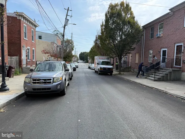 a view of street with parked cars