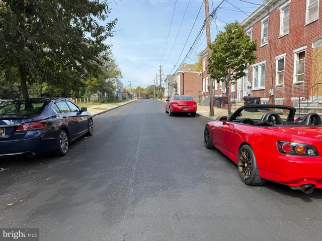 a view of street with parked cars