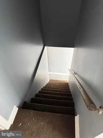 a view of an empty room and a window