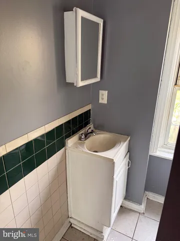 a white toilet sitting next to a window