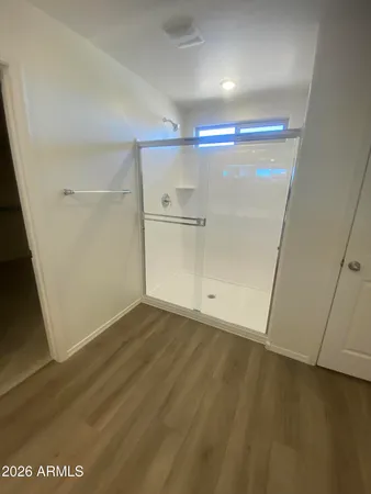 an empty room with wooden floor