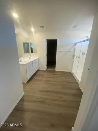 a view of a kitchen with white cabinets