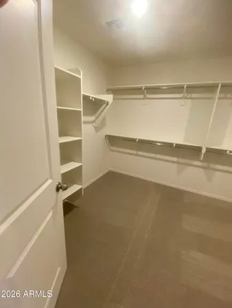 a view of an empty walk in closet