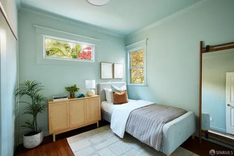 a bedroom with a bed and window