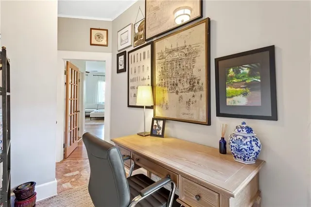a view of a dining room with furniture and a large window
