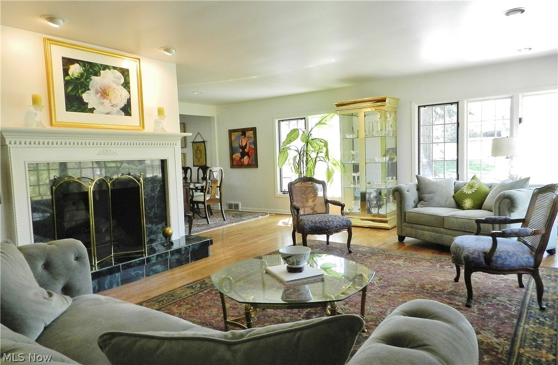 The flow from  living room to dining room contributes to the sense of light and openness.