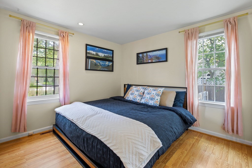 225 Skunknet Road Barnstable, MA 02632 - Photo 15 of 27 a bedroom with a bed and a large window