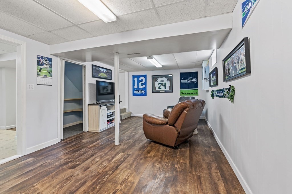 225 Skunknet Road Barnstable, MA 02632 - Photo 18 of 27 a living room with furniture and a flat screen tv