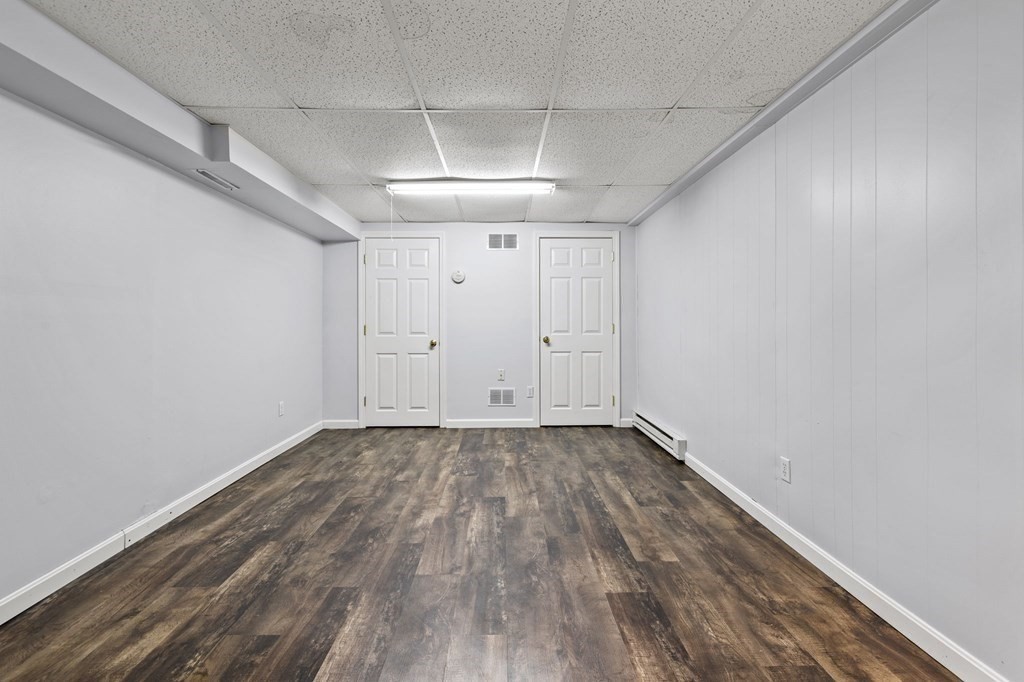 225 Skunknet Road Barnstable, MA 02632 - Photo 20 of 27 a view of an empty room with wooden floor