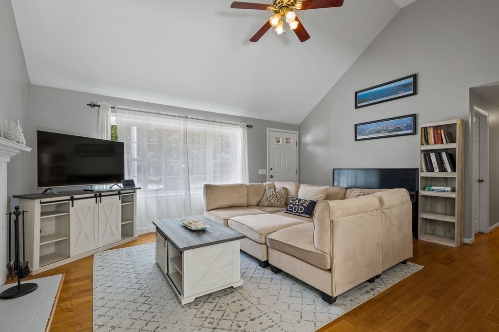 225 Skunknet Road Barnstable, MA 02632 - Photo 2 of 27 a living room with furniture and a flat screen tv