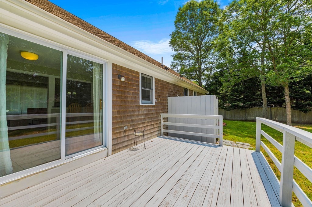 225 Skunknet Road Barnstable, MA 02632 - Photo 22 of 27 a balcony with view of outdoor space