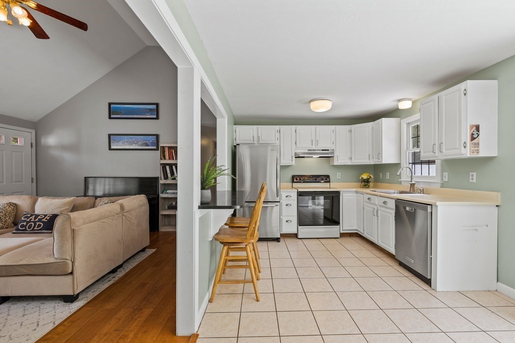 225 Skunknet Road Barnstable, MA 02632 - Photo 8 of 27 a kitchen with cabinets and counter