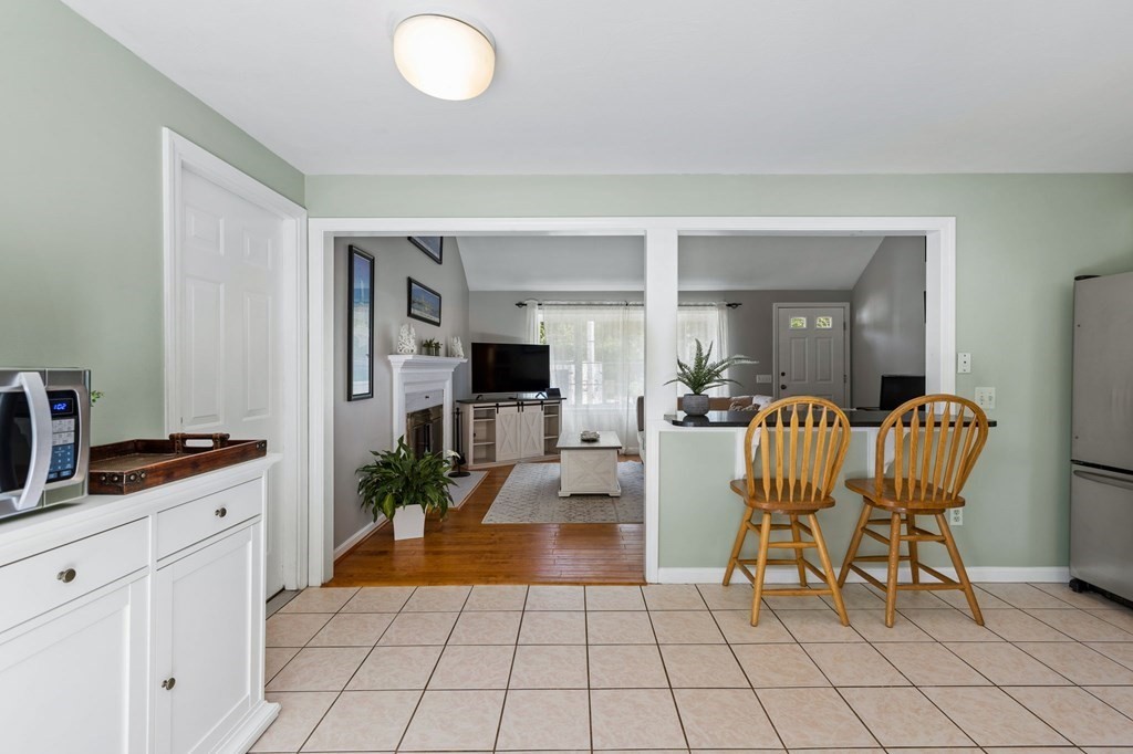 225 Skunknet Road Barnstable, MA 02632 - Photo 10 of 27 a living room with furniture and a flat screen tv